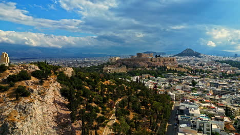 panoramic view of cityscape and the acropolis hill with parthenon in athens, greece