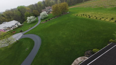 fpv flight around luxury villa in suburb of usa with solar panels on rooftop