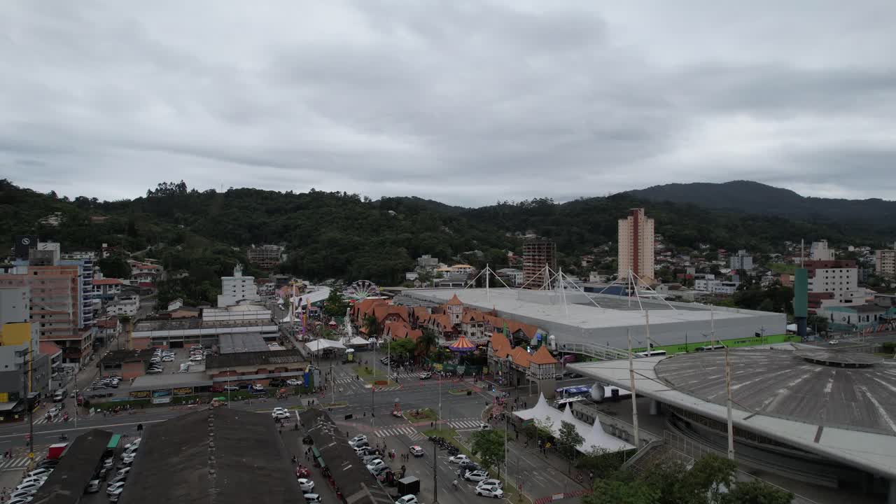 Drone footage of the Oktoberfest party in Vila Germ&acirc;nica, outdoor area with the amusement park, decorations and people, city of Blumenau, Santa Catarina, Brazil