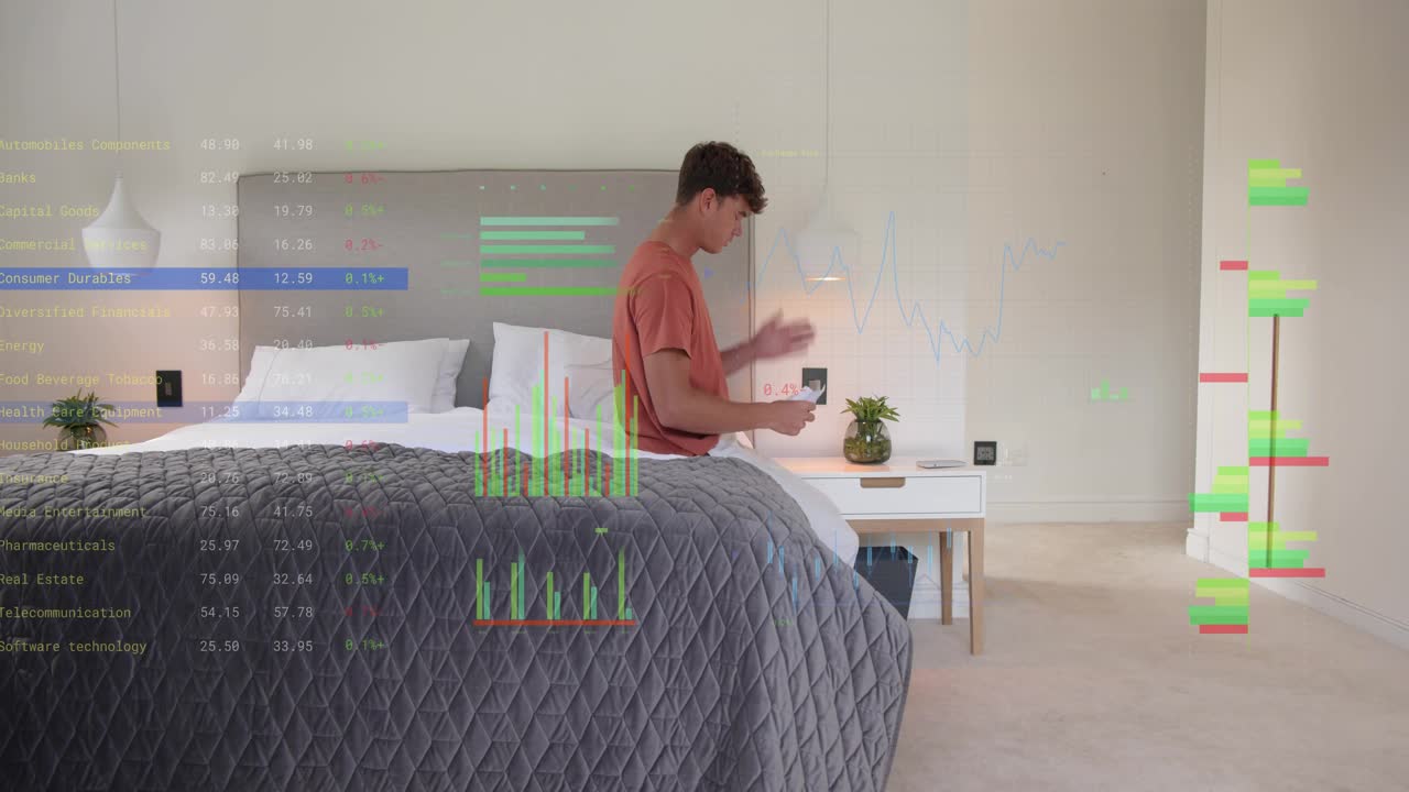 Man entering bedroom carrying tablet and activating tech overlay with graphs while reading papers