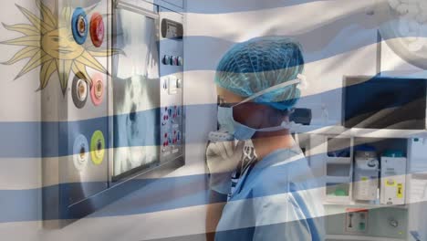 Animation-of-waving-flag-of-argentina-over-biracial-female-doctor-examining-patient-x-ray-reports