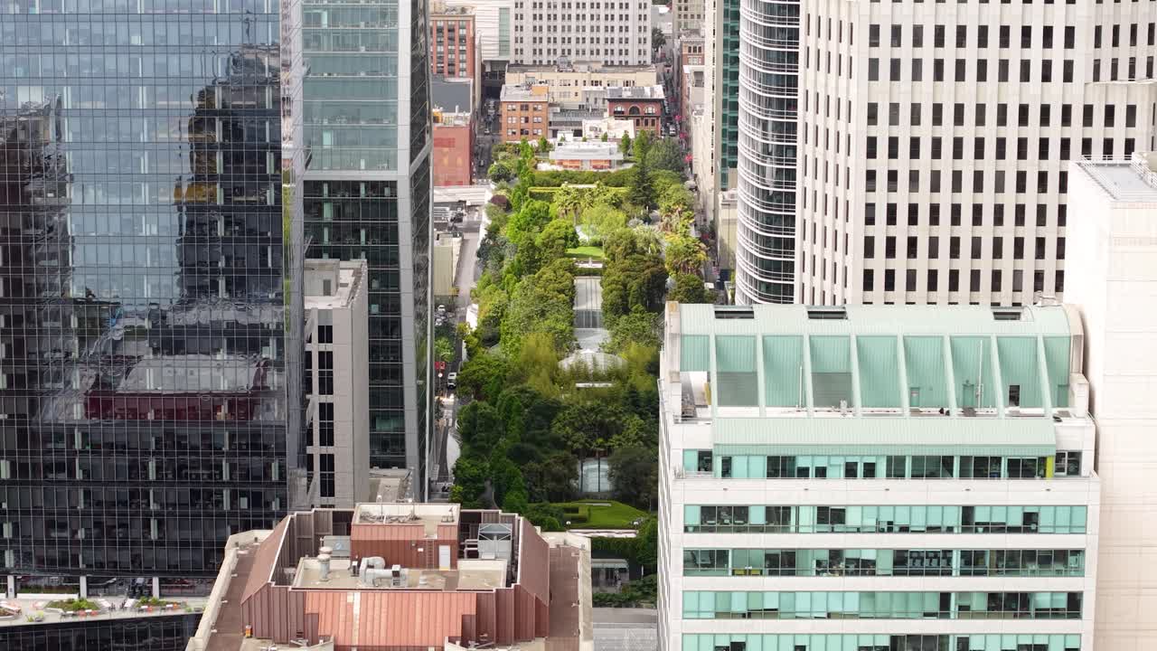 Drone Shot of Salesforce Park Between Skyscrapers of Downtown San Francisco USA, Elevated Gardens and Buildings