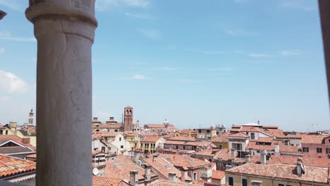 Venice_pan_up_to_San_Marco_tower_viewed_from_-Palazzo_Contarini_del_Bovolo_column,-4-K,-59