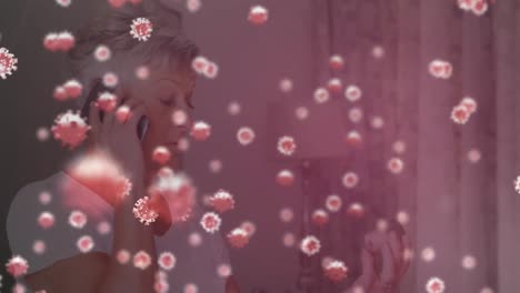 Animation-of-covid-19-cells-floating-over-sick-woman