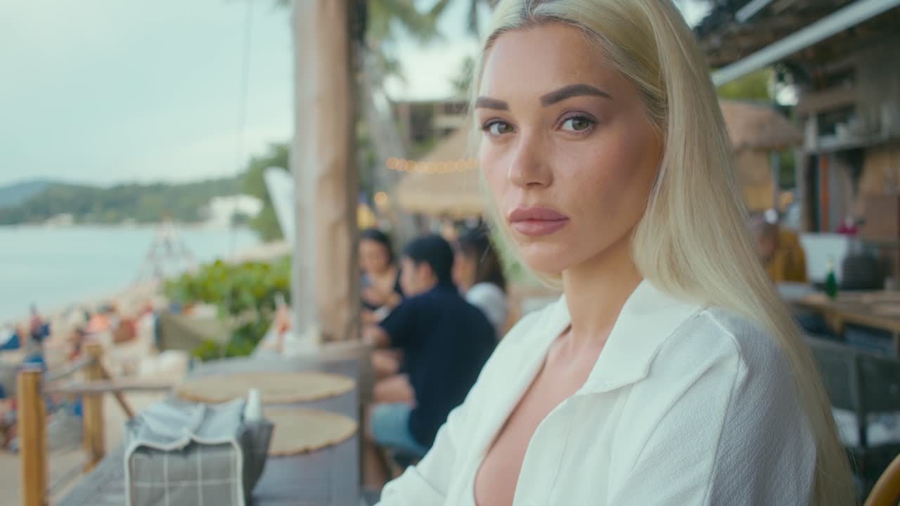 Woman Relaxing at Beach Cafe