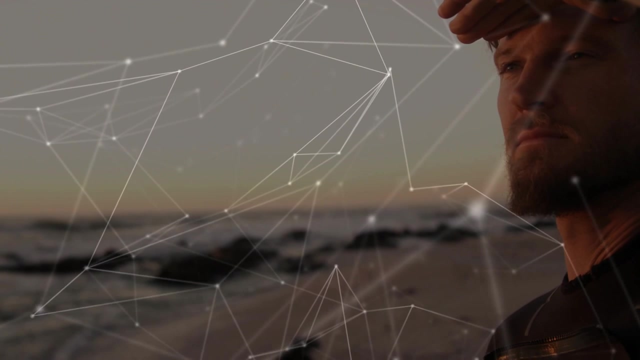 Muž hledící na oceánský horizont s překryvem digitální sítě