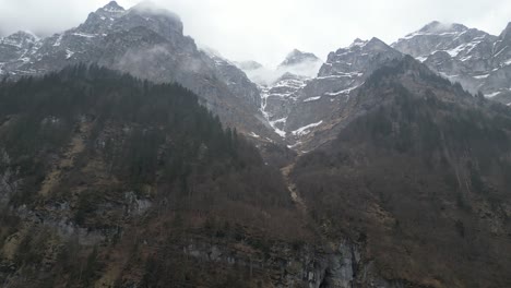 Klöntalersee-Glarus-Switzerland-flight-looking-up-at-the-ice-and-misty-mountain-peaks