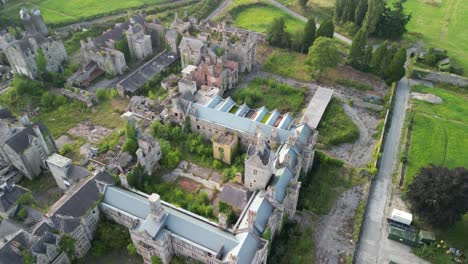 haunted denbigh lunatic asylum, north wales, aerial anticlockwise rotate from near and pull back, sunny afternoon