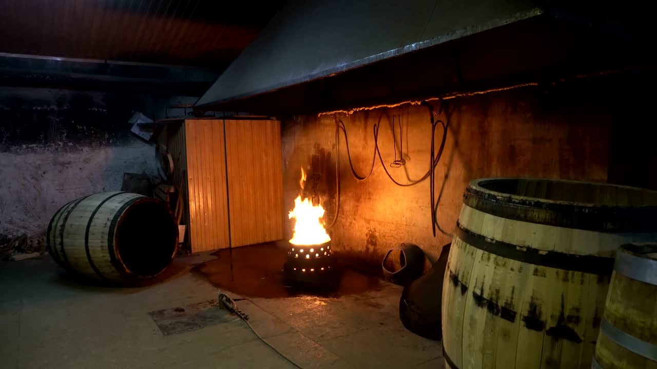 The process of roasting oak barrels for wine in a cooperage