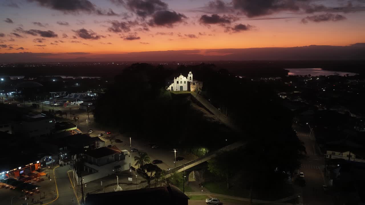 Illuminated Monastery At Itanhaem In Sao Paulo Brazil. Touristic Attraction. Downtown Cityscape. Matrix Square. Illuminated Monastery At Itanhaem In Sao Paulo Brazil. Sunset Skyline