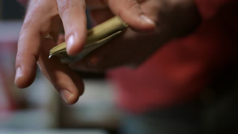 Man-hand-showing-dollar-banknotes.-Close-up-of-american-cash-money-in-male-hands