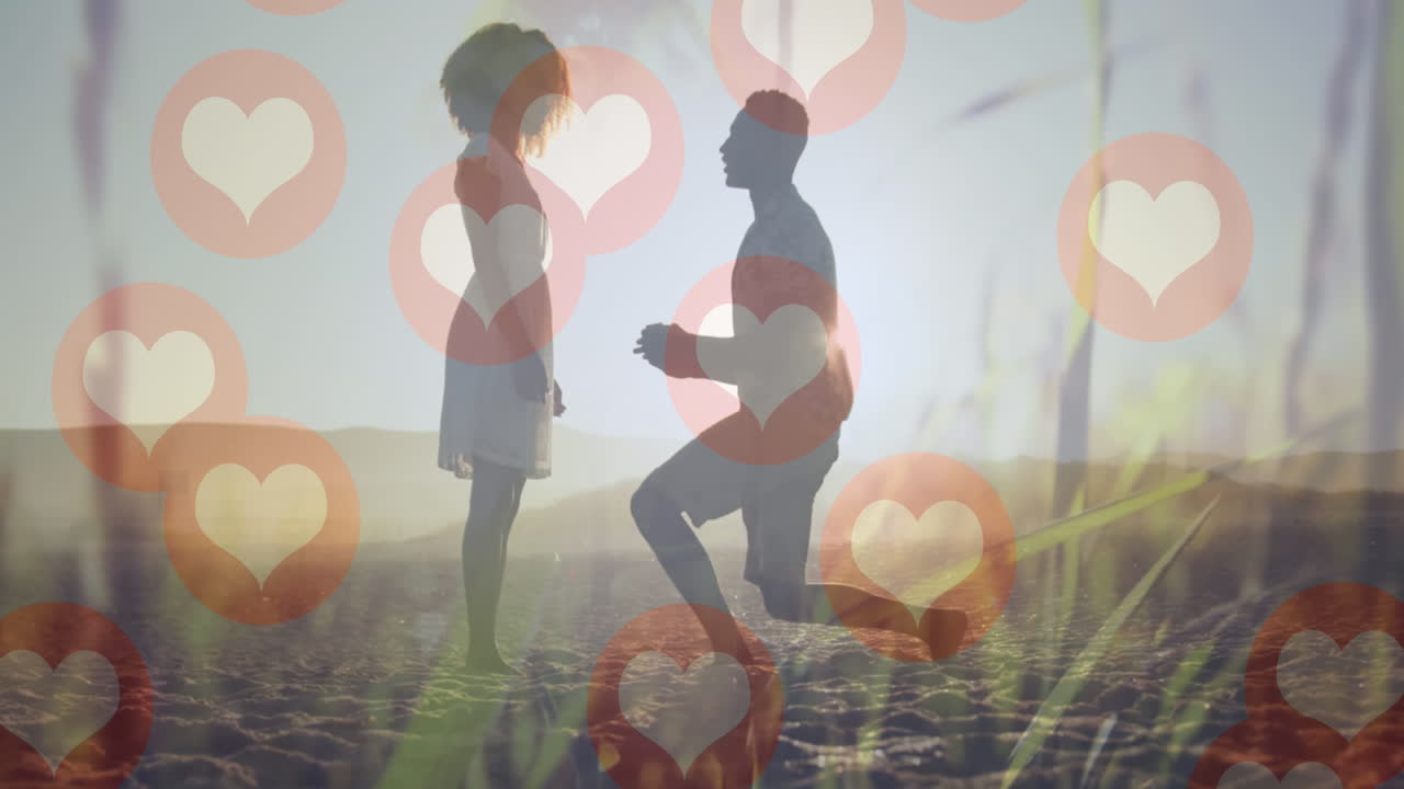 커플 위에 떨어지는 심장 아이콘의 애니메이션