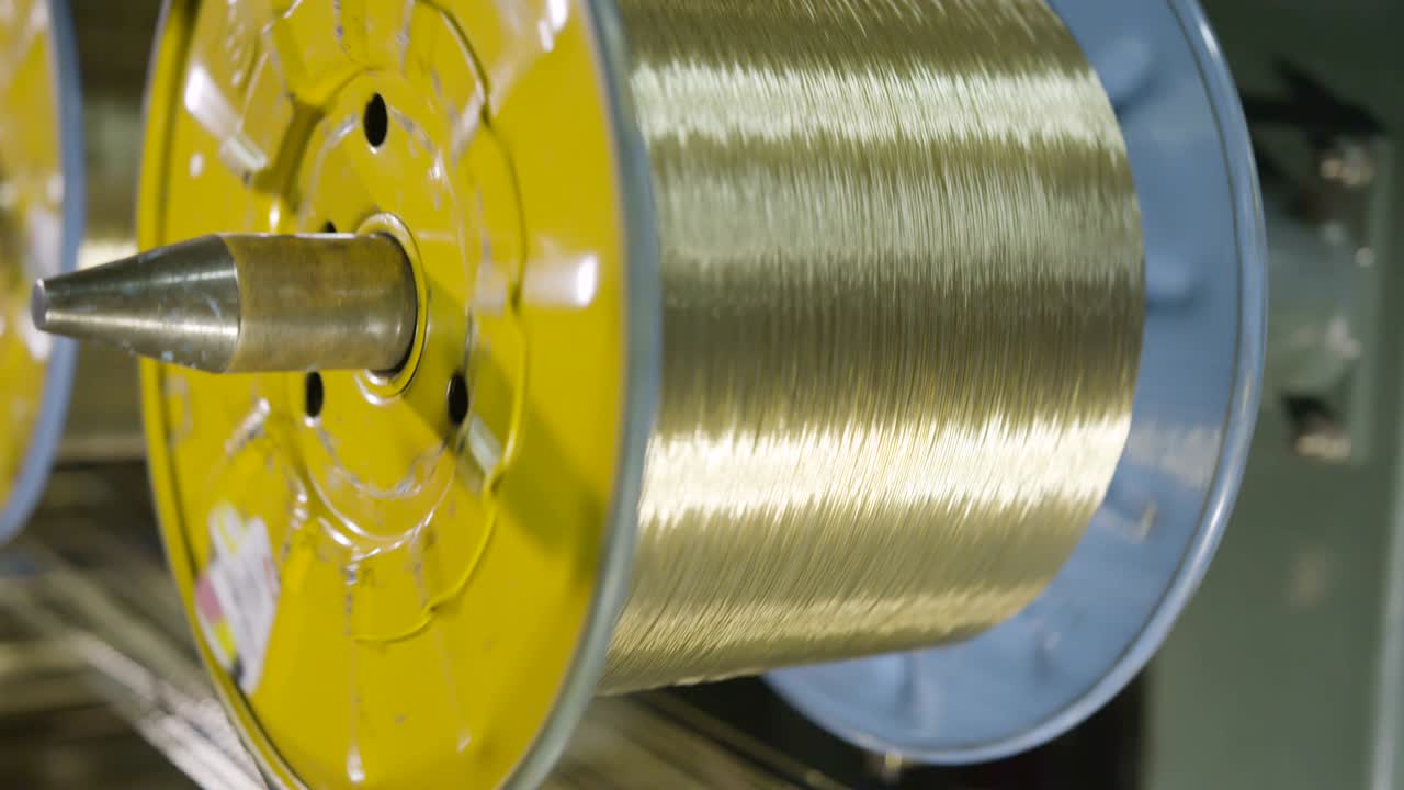 Camera Moves Past Bobbins with Textile Threads