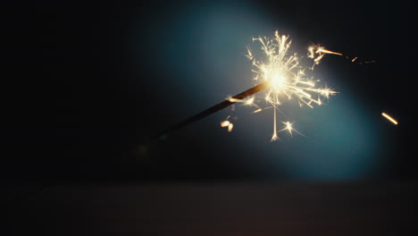 a sparkler burn in the dark room