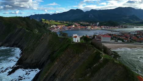 spectacular views of the hermitage of la guia dominating the entrance to the cove of the mythical port of ribadesella in asturias