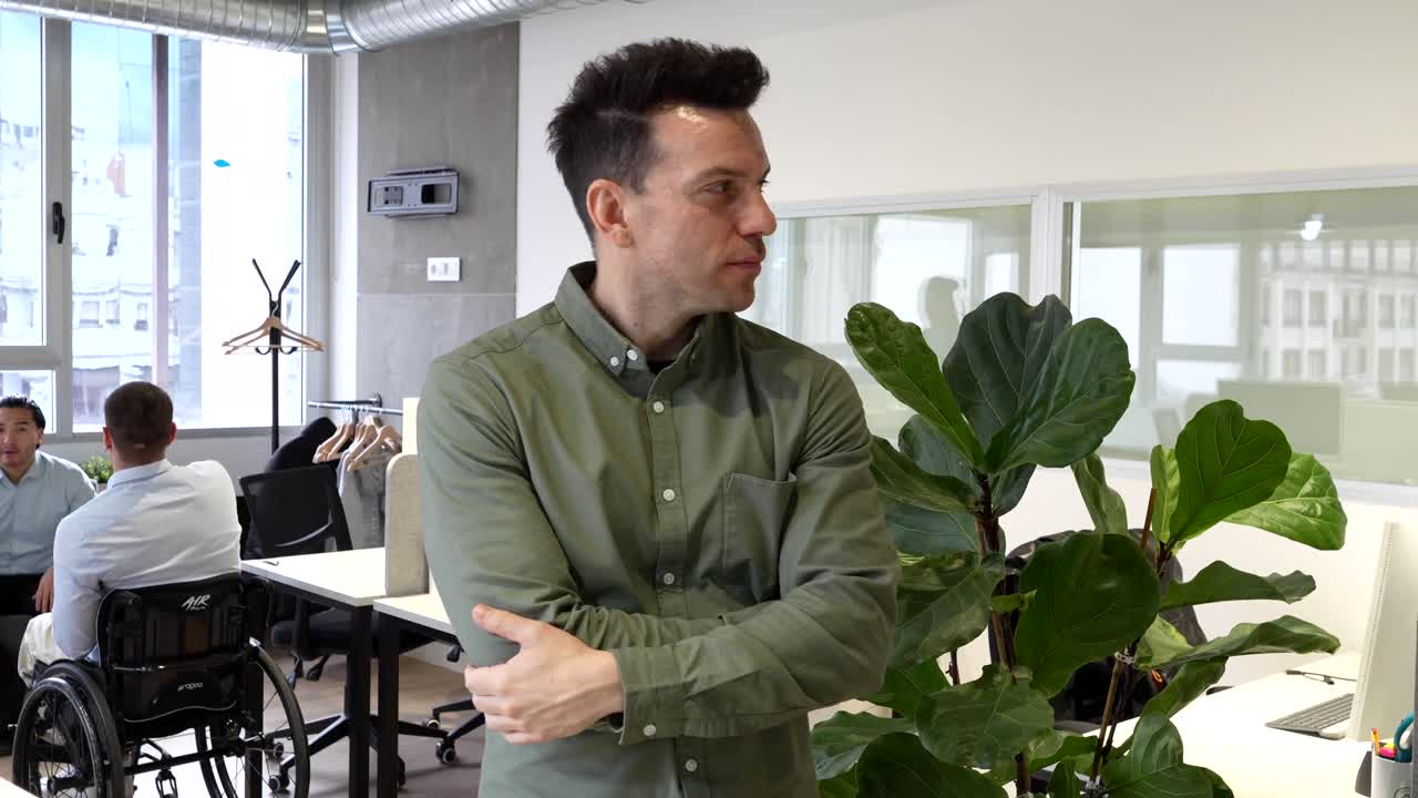 Man in office with colleagues