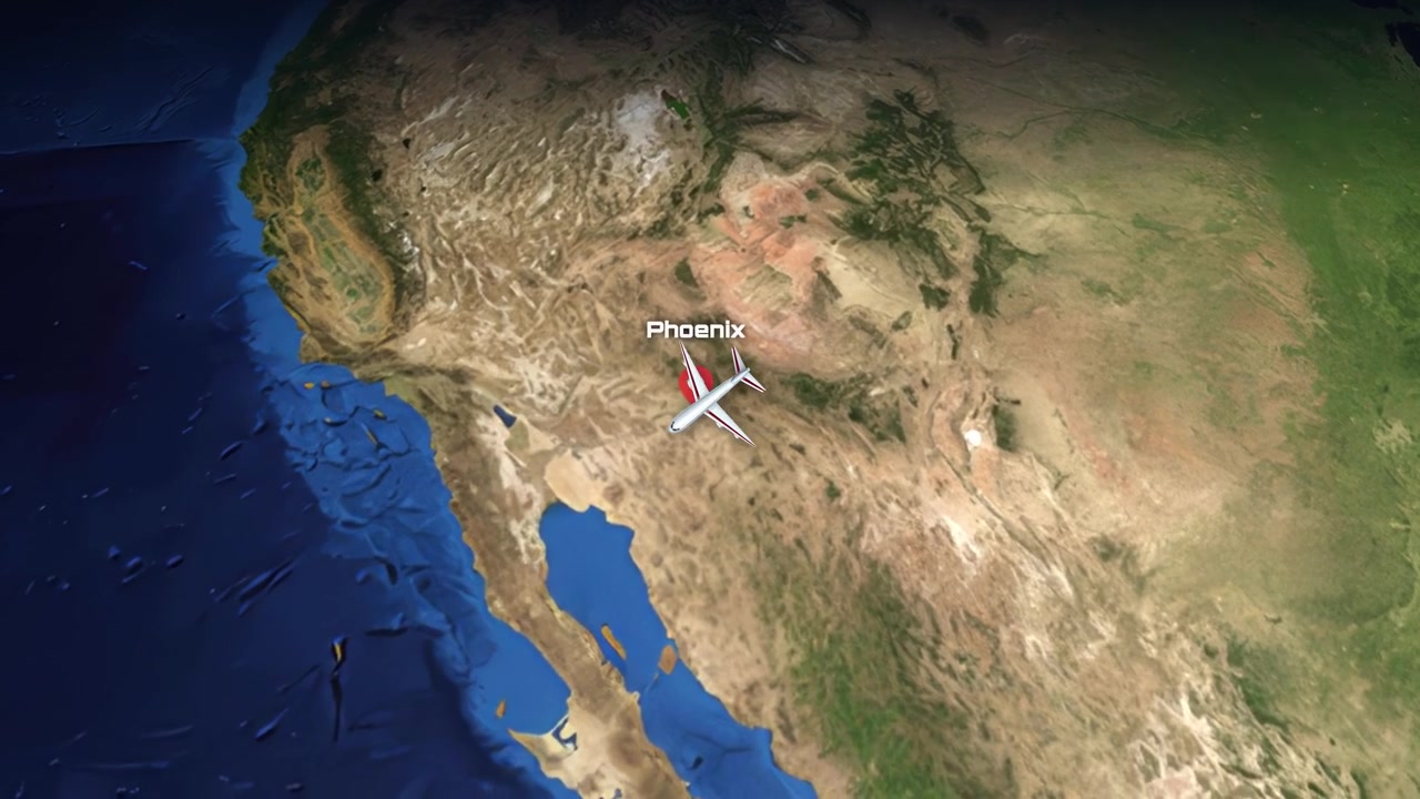 Satellite view animation follows a commercial airplane flying from Madrid across the Atlantic to Phoenix