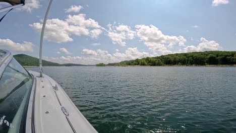 the side and windshield of sports boat cruising