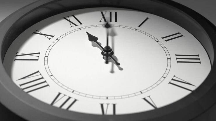 Latin Clock Face in Time Lapse on White Wall