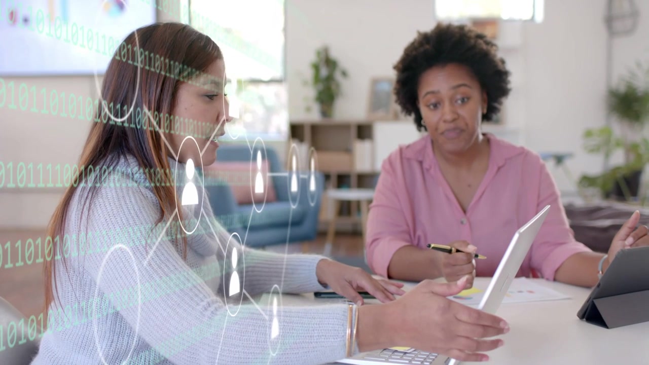 Left woman speaking lifting tablet, right woman pointing, user icons linking screens for business