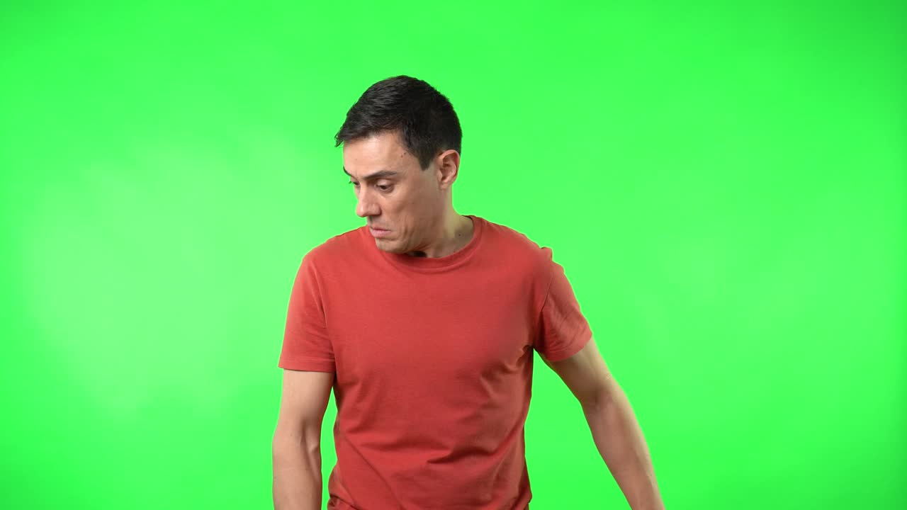 A man displaying a range of emotions and reactions on a green screen