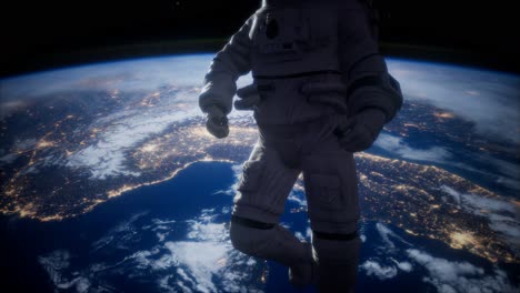 astronauta en el espacio exterior con el telón de fondo del planeta tierra. imagen de la tierra proporcionada por la nasa