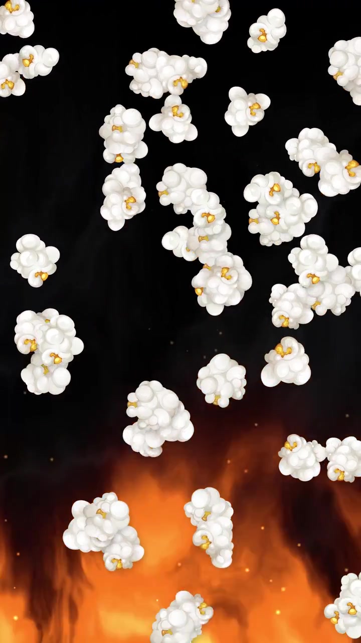 Chicchi di popcorn bianchi cadono su uno sfondo nero sopra fiamme arancioni realistiche e fumo