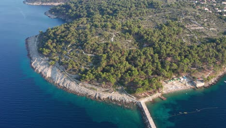 aerial shot dollying back from veli losinj, croatia on a bright sunny day