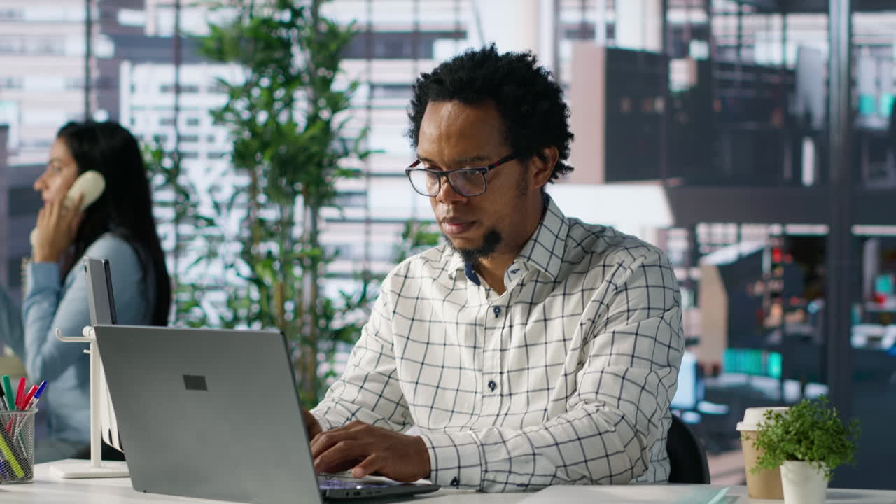 Man working on laptop in office