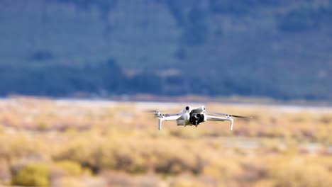 A drone flies steadily over a picturesque landscape in Glenorchy, New Zealand, captured in clear daylight with stable camera movement
