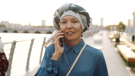 mature woman talking on phone on walk