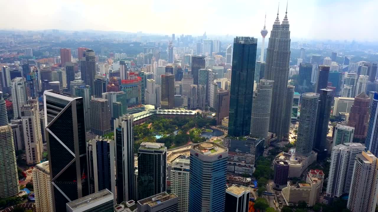 Aerial view of Kuala Lumpur Downtown, Malaysia. Financial district and business centers in smart urban city in Asia. Skyscraper and high-rise buildings at sunset.