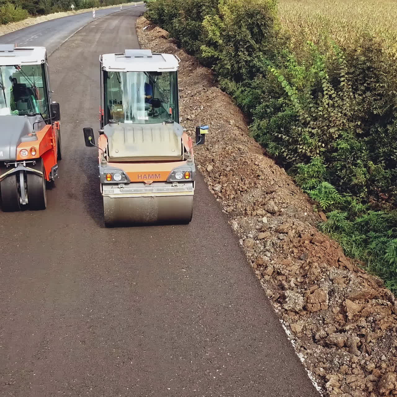 Large road-roller paving a road. Road construction