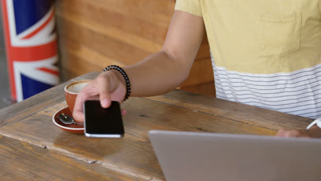 man using laptop and mobile phone 4k