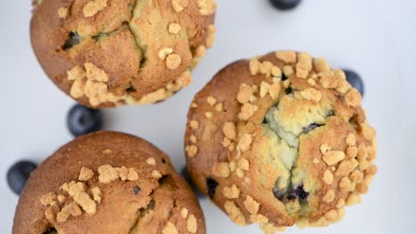 portion of blueberry muffins rotating on a plate (seamless loopable)