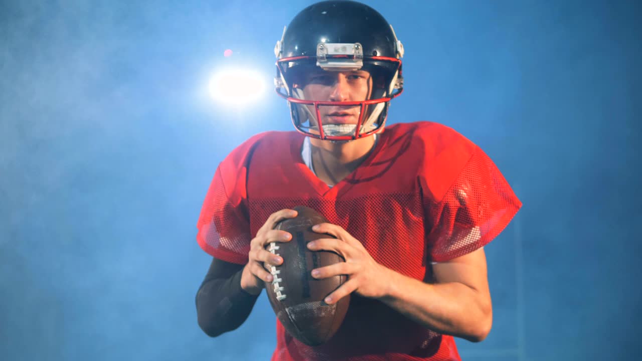 연기 배경에 있는 아메리칸 볼 선수, 근접.