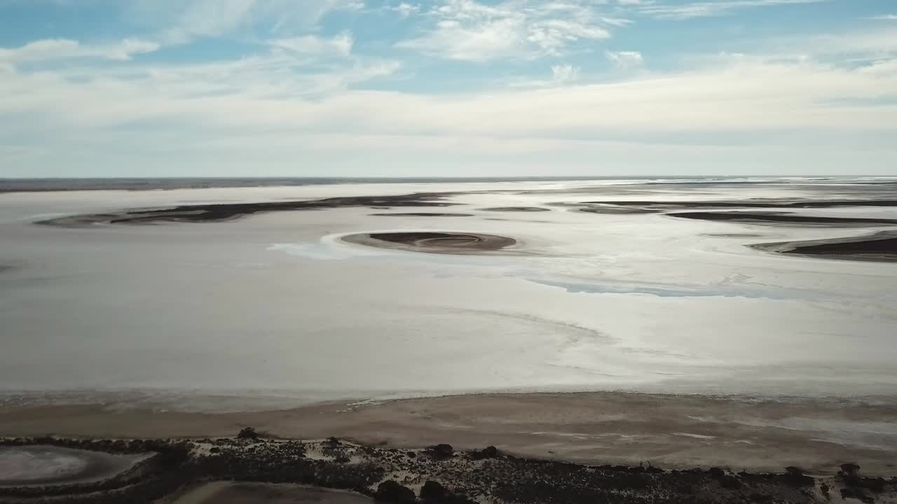 Aerial footage of small islands near the edge of Lake Tyrell, in north-west Victoria, May 2021.