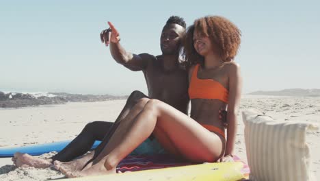 african american couple enjoying sea view