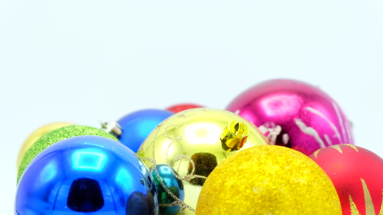 Christmas colorful balls close-up footage for loop on white.