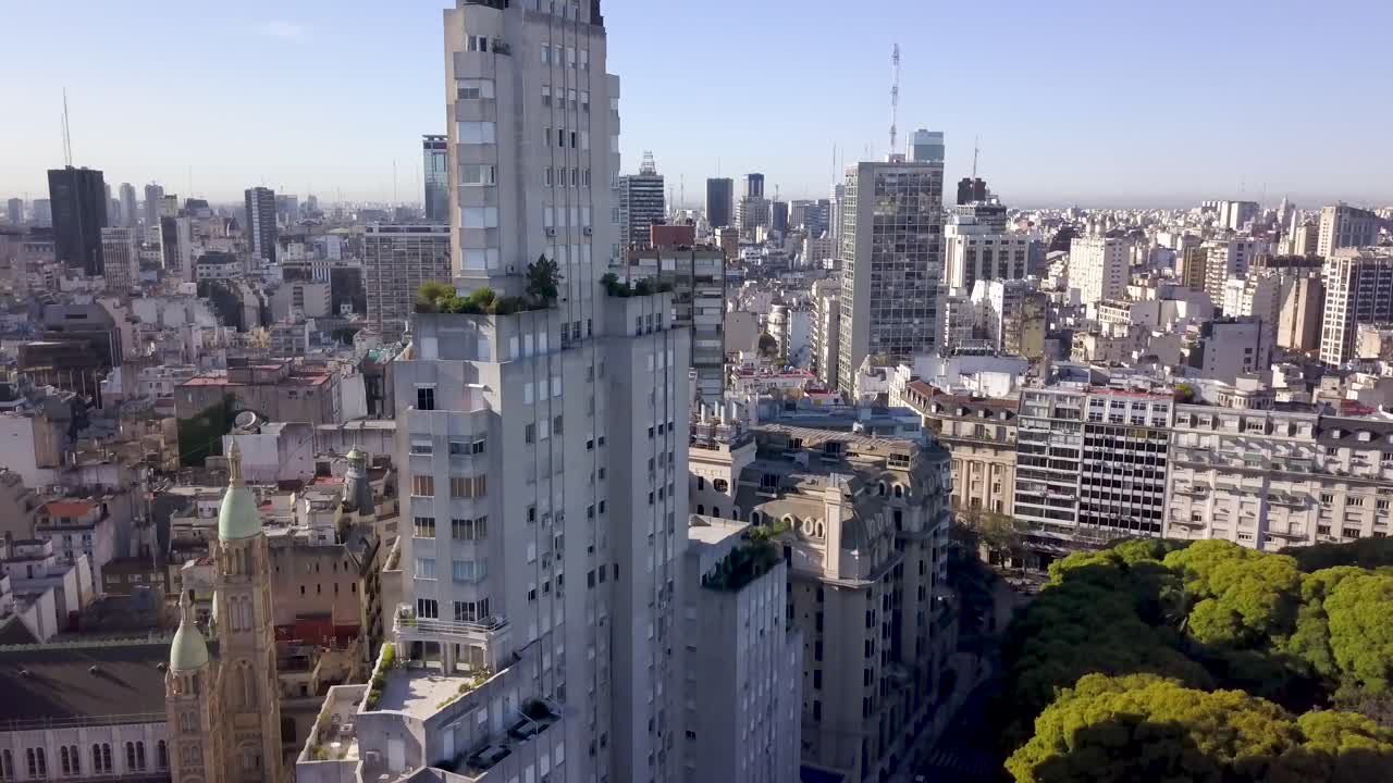 Aerial lowering shot of Kavanagh building, descending over Plaza San Martin, Buenos Aires