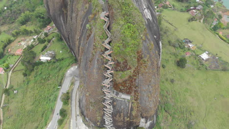 view of the rock el penol near the town of guatape, antioquia in colombia - aerial drone shot