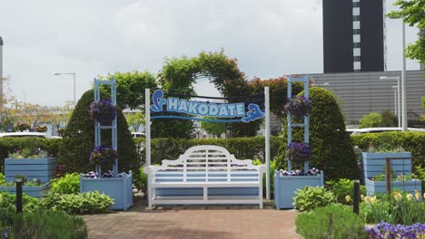 welcome to hakodate japan sign in the garden next to the main train station