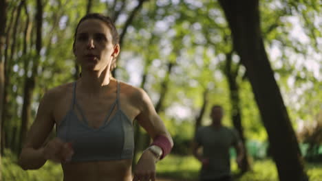 woman and man jogging in the park