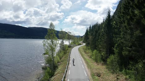 road cyclist riding in beautiful nature in norway