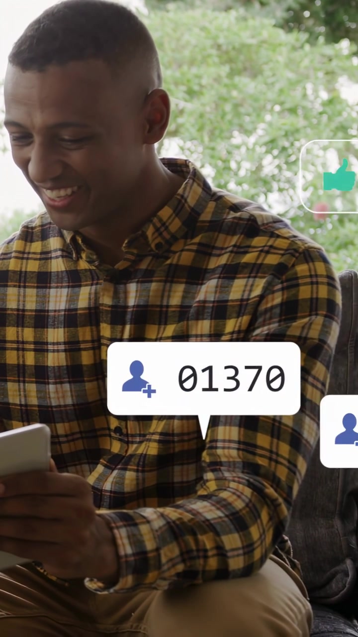 Vertical video: Man scrolling phone as social media alerts popping on frame, counts rising, smiling