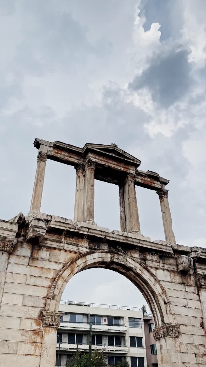 Ancient Arch of Hadrian Under Cloudy Skies in Athens
