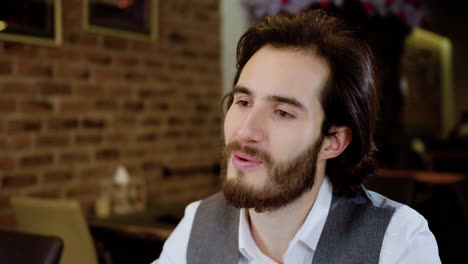 closeup of man's face in a restaurant