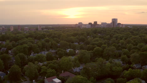 Clayton-neighborhood-and-nice-houses-at-sunset-with-tilt-up-towards-skyline-on-a-summer-evening-in-St