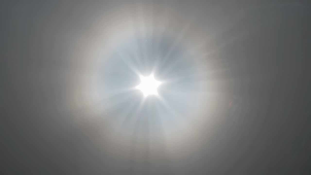 Recording frames, circular LED fixture pulsing at ceiling with star core and ring LEDs