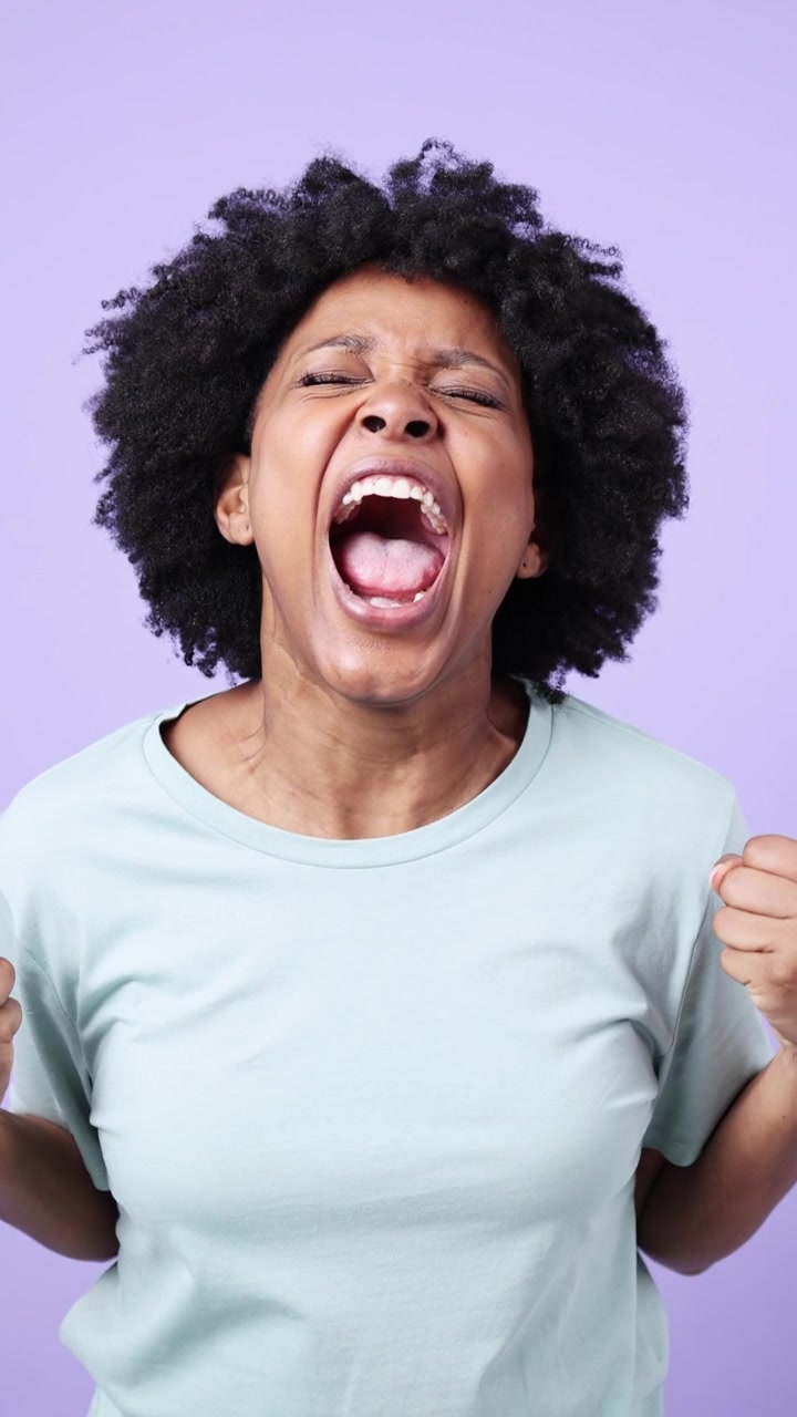 African American Woman Screaming with Intense Emotion and Frustration